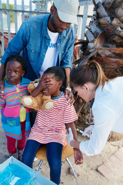 almost-now-shot-volunteer-nurse-giving-injections-underprivileged-kids